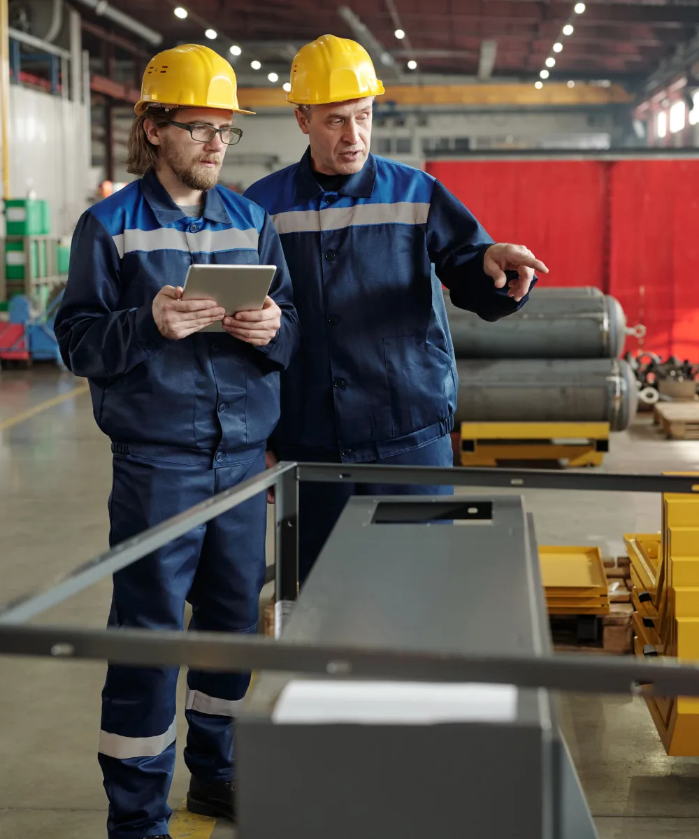 A procurement manager at a manufacturing company reviewing supplier websites and digital content during a vendor evaluation